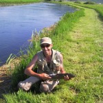 Peter tickles a trout....