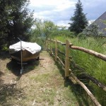 One side of the fence - pike sailboat in evidence.
