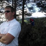 Steve Rajeff limbering up the background, Lee unfazed, Steve slightly concerned.