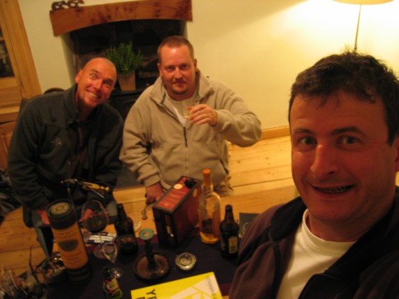 plunder4.jpg - Here we are involved in a very complicated flytying sequence. Notice the vast quantities of alcohol scattered around the table. That's just for decoration. None of us actually drink, well apart from Lars, who drinks a vile brew called Gammel Dansk. You'll also notice how it is me who's sitting by the vice. That can only mean one thing: imminent catastrophe.