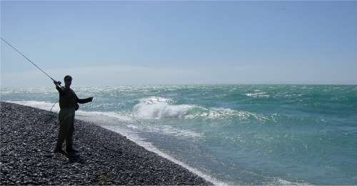 Tom about to launch into the Waitaki surf
