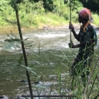 Ralak fishing a double handed traditional Orang Asli rod - exactly as we used to use, although cut from a palm and with a Cat's Whisker on the end :)